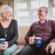 55 year old couple enjoying new lifestyle after best age to downsize to a park home