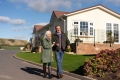 couple walking in residential park home development