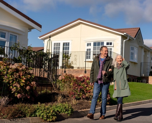 couple walking in park home development