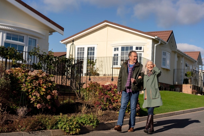 couple walking in park home development