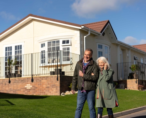 couple walking in park home development