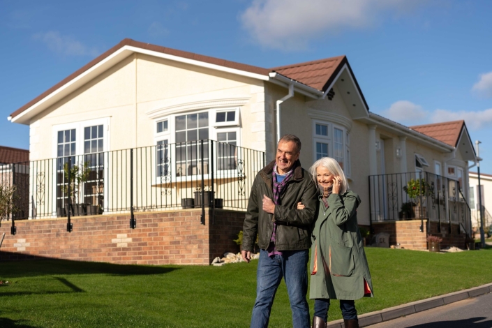 couple walking in park home development