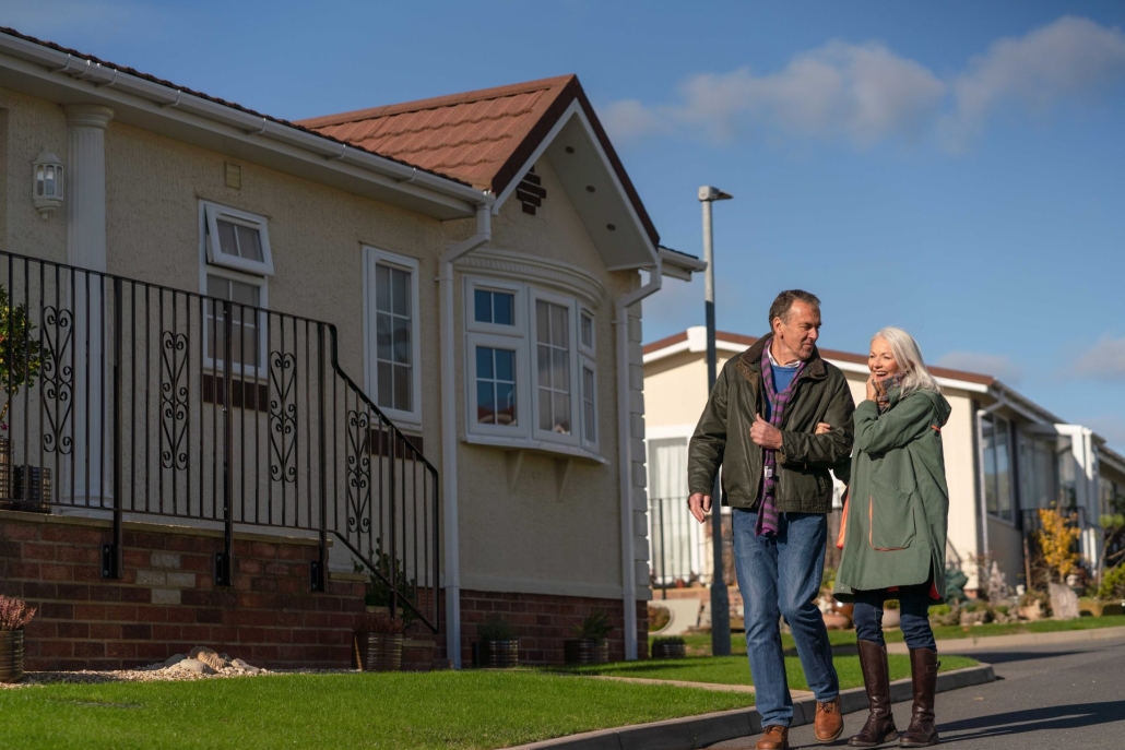 couple walking in park home development