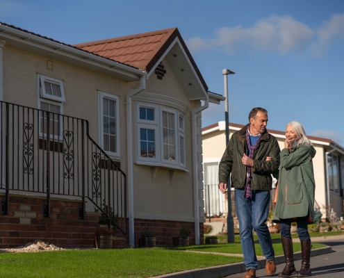 couple walking in park home development