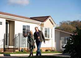 couple walking in park home development