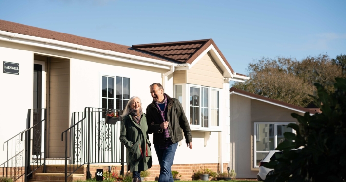 couple walking in park home development