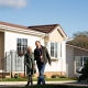 couple walking in park home development