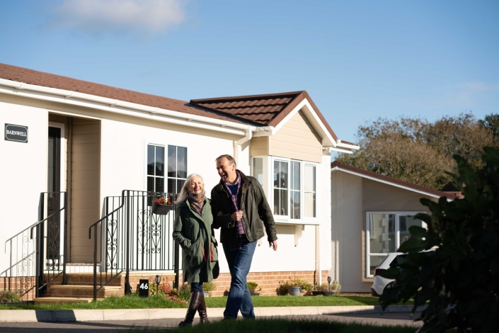 couple walking in park home development