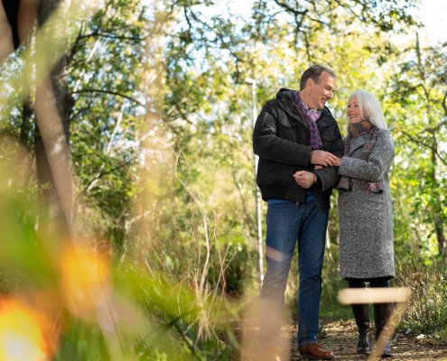 couple walking in woodland