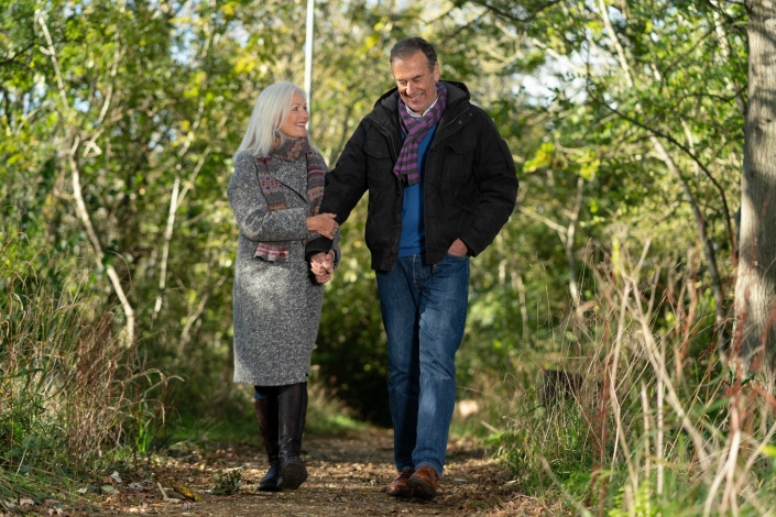 couple walking in woodland