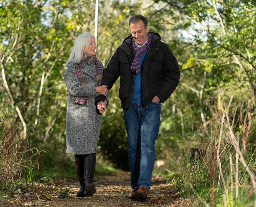 couple walking in woodland