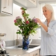 lady arranging flowers inside park home