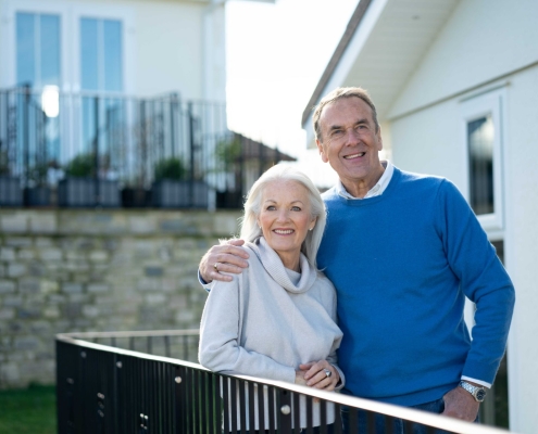 couple outside park home